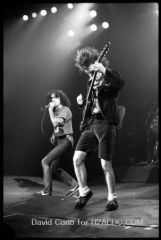 Bon Scott (l) and Angus Young (r) of AC/DC at Hammersmith Odeon, London