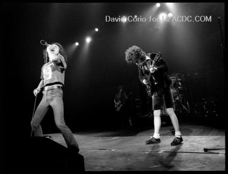 Bon Scott (l) and Angus Young (r) of AC/DC at Hammersmith Odeon, London 